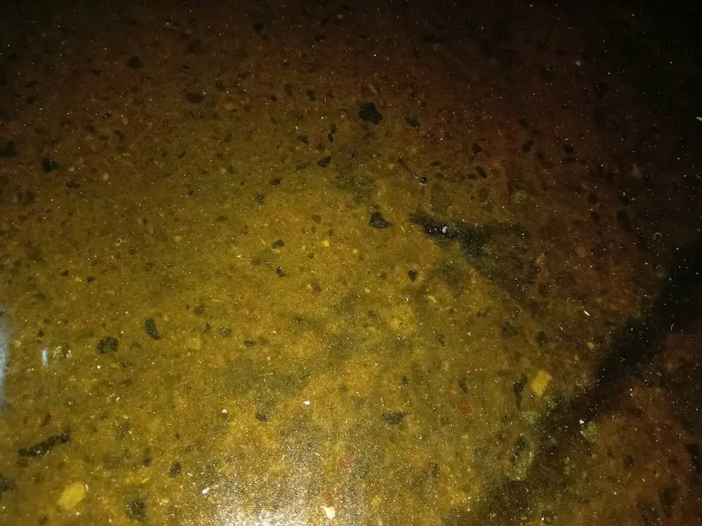 Image showing a proper consolidated laminate notice that there are no fibres present, translucent appearance and you can see the prepared concrete underneath